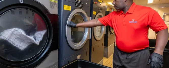 MAN WORKING TUMBLE DRYER