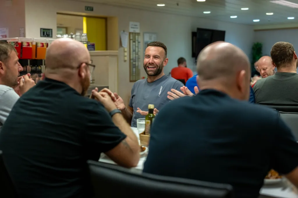 MEN AT A TABLE